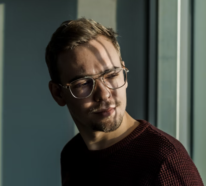 Man with glasses indoors